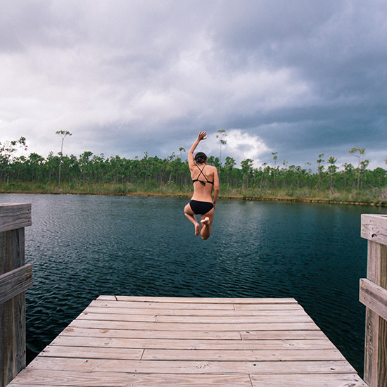 woman jump into lake