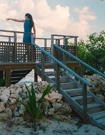 woman on a dock at sea